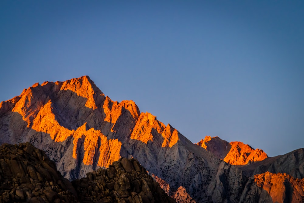 brown rocky mountain under blue sky during daytime