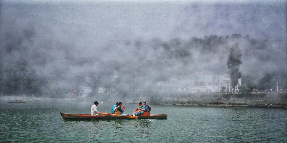 people riding on boat on water during daytime