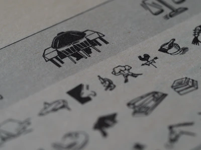 Print project showcasing textured paper and sharp, clean illustrations inspired by Roman motifs.