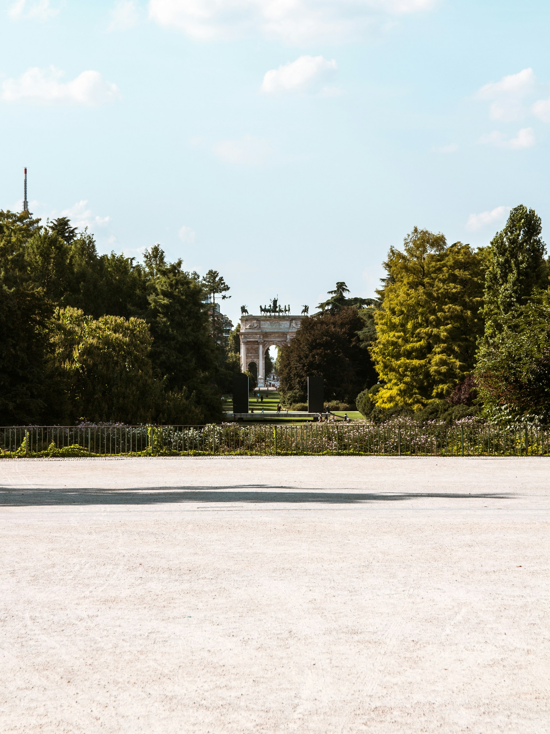 green trees near white concrete building during daytime