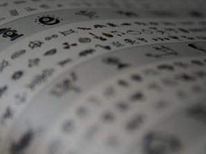 A detailed close-up of layered symbols blending Christian and pre-Christian iconography on paper.