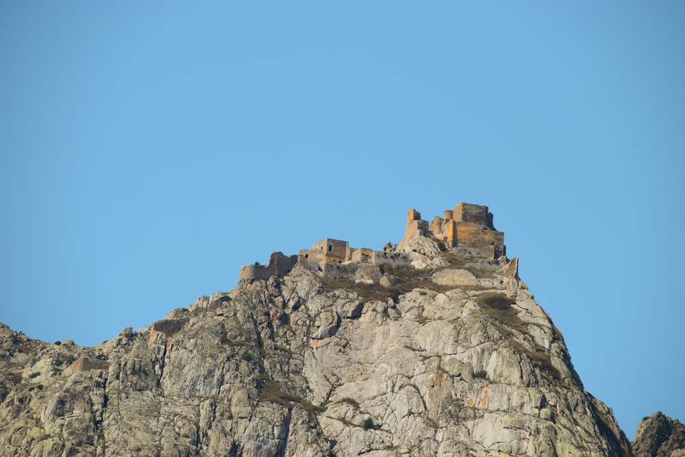 brown rock formation under blue sky during daytime