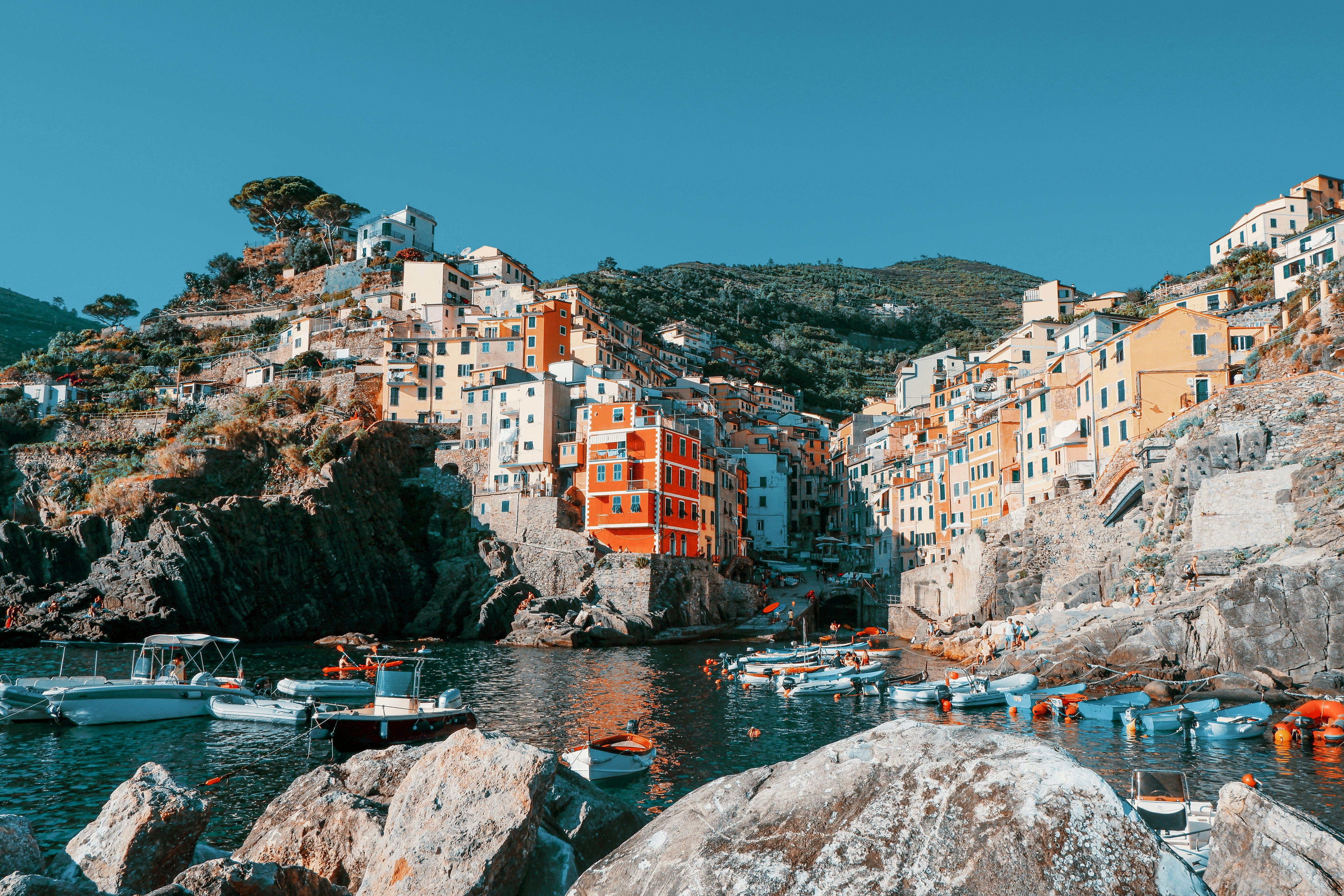 brown and white concrete buildings near body of water during daytime