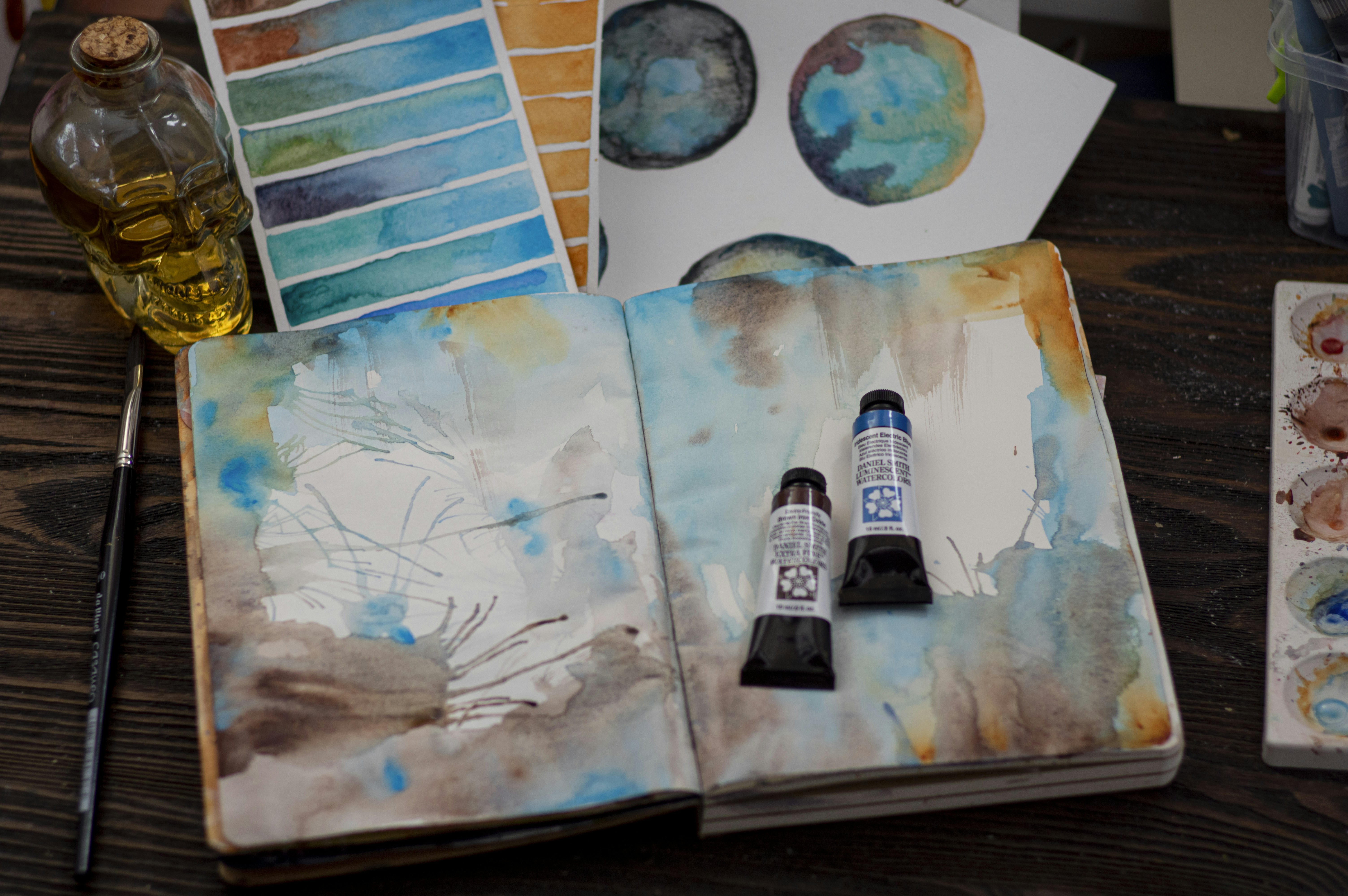 white and black labeled bottle on white table