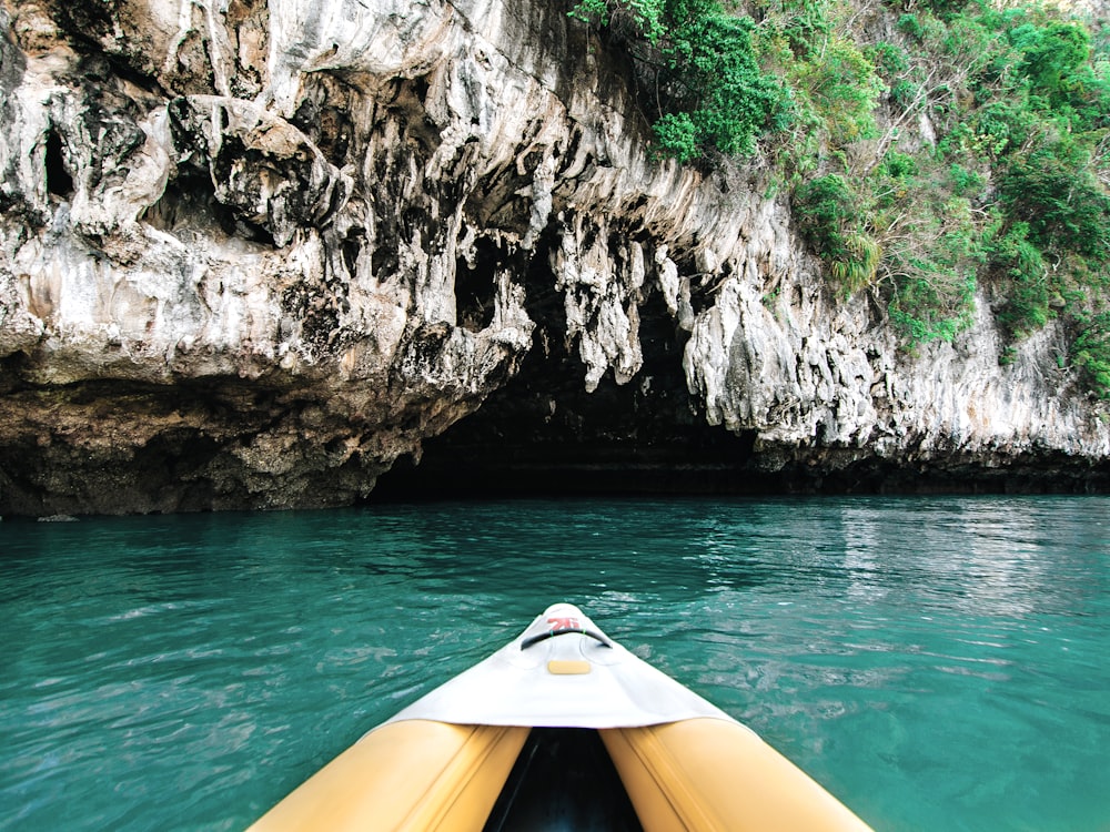 yellow kayak on rocky mountain