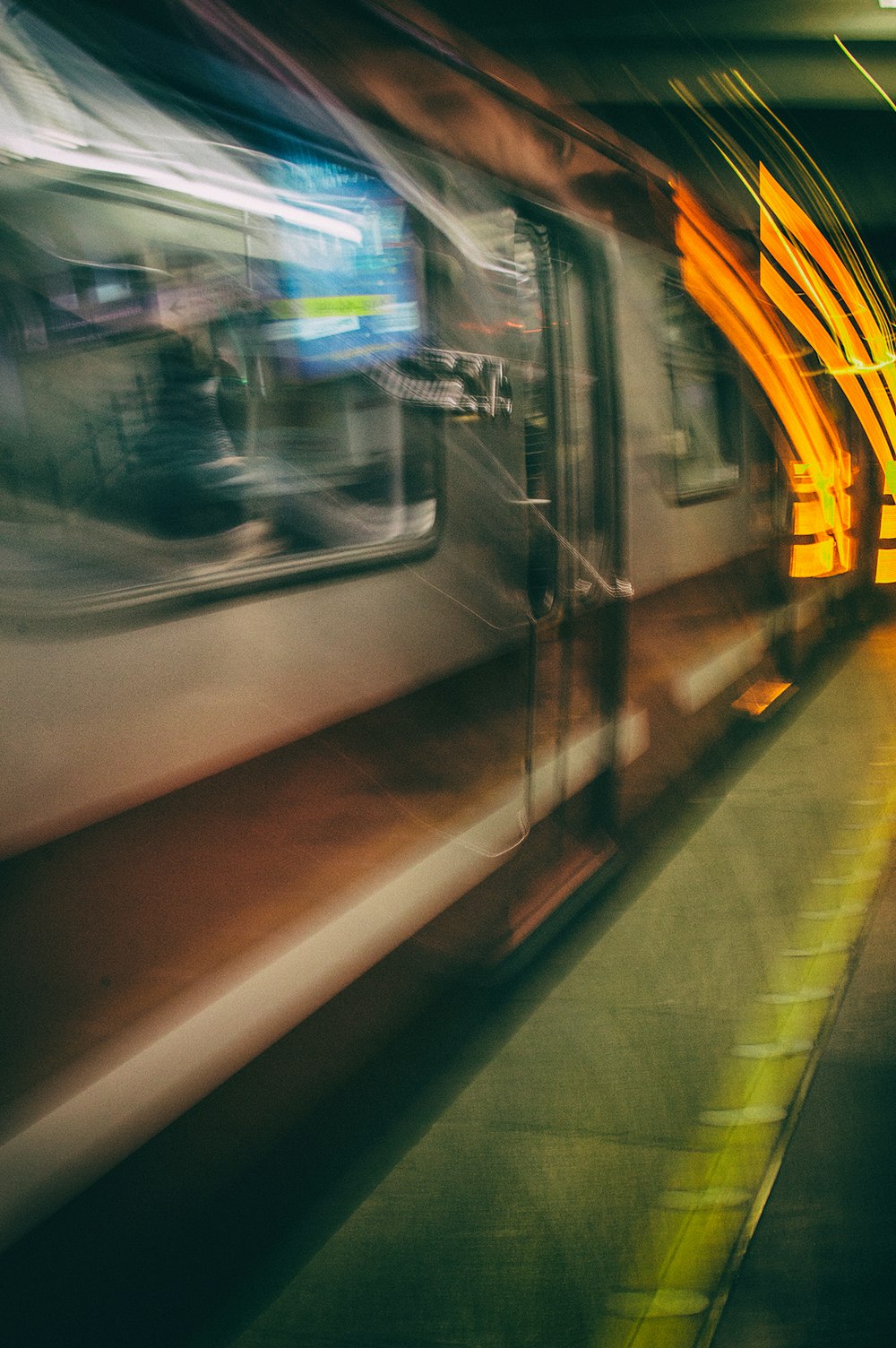 white and black train on train station