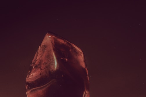 A rare ruby gemstone with deep red hues on display.