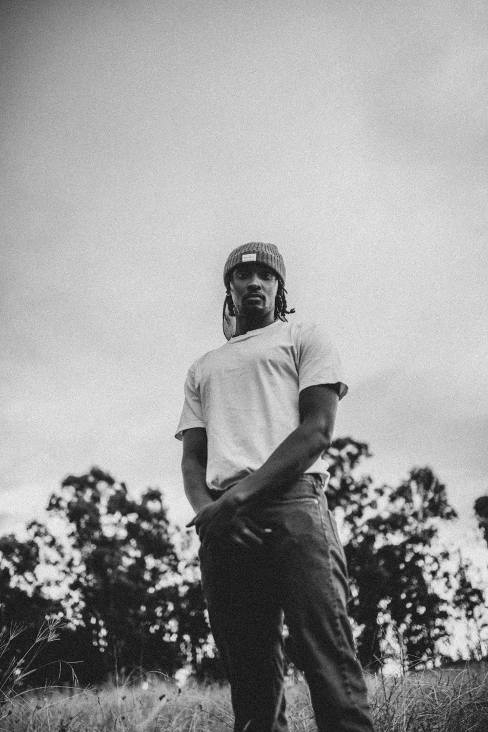 man in white t-shirt and black pants