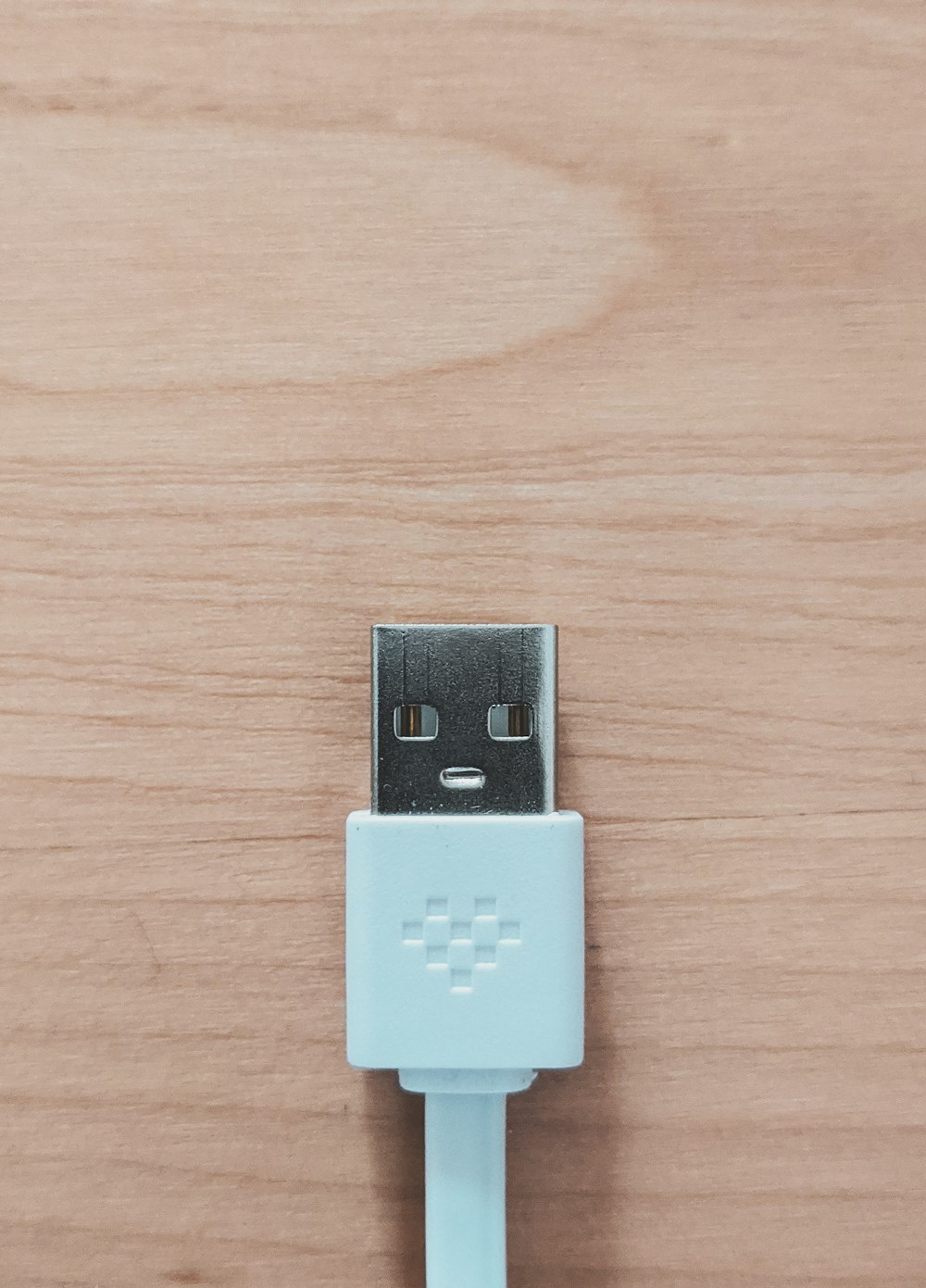 white usb flash drive on brown wooden table