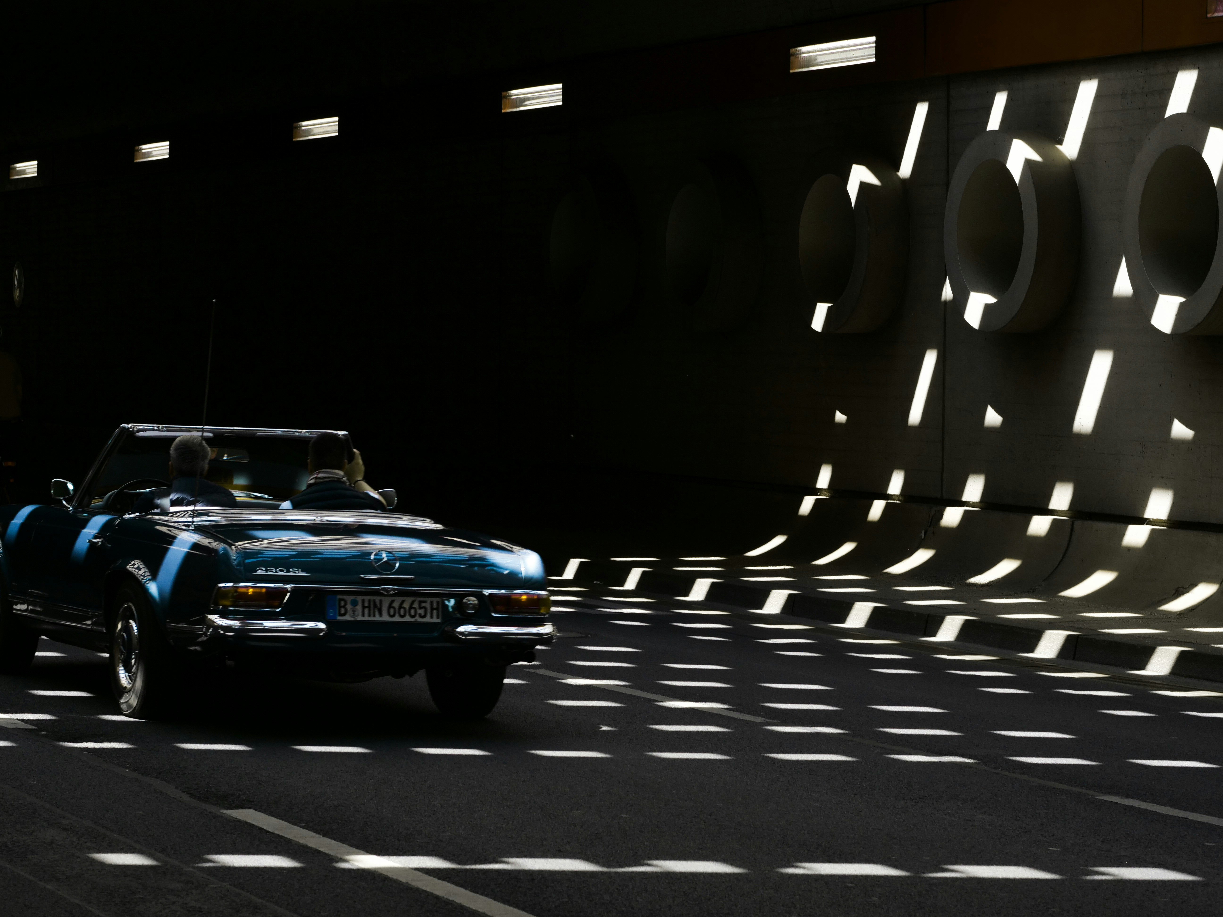 blue car parked on parking lot during night time