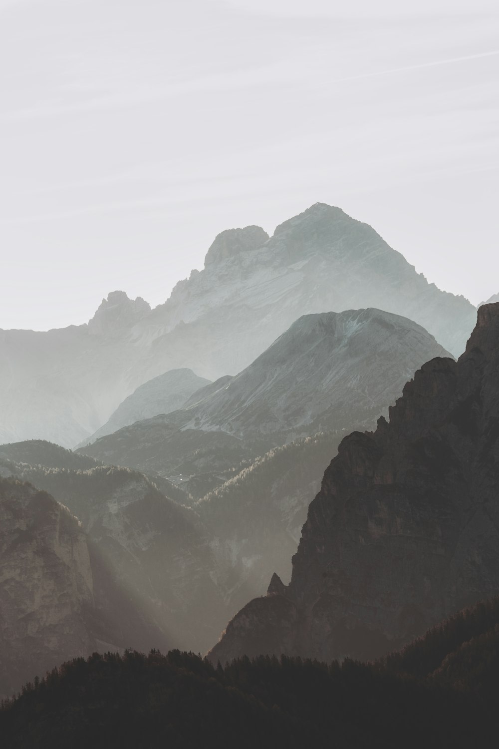 green and brown mountains under white sky during daytime