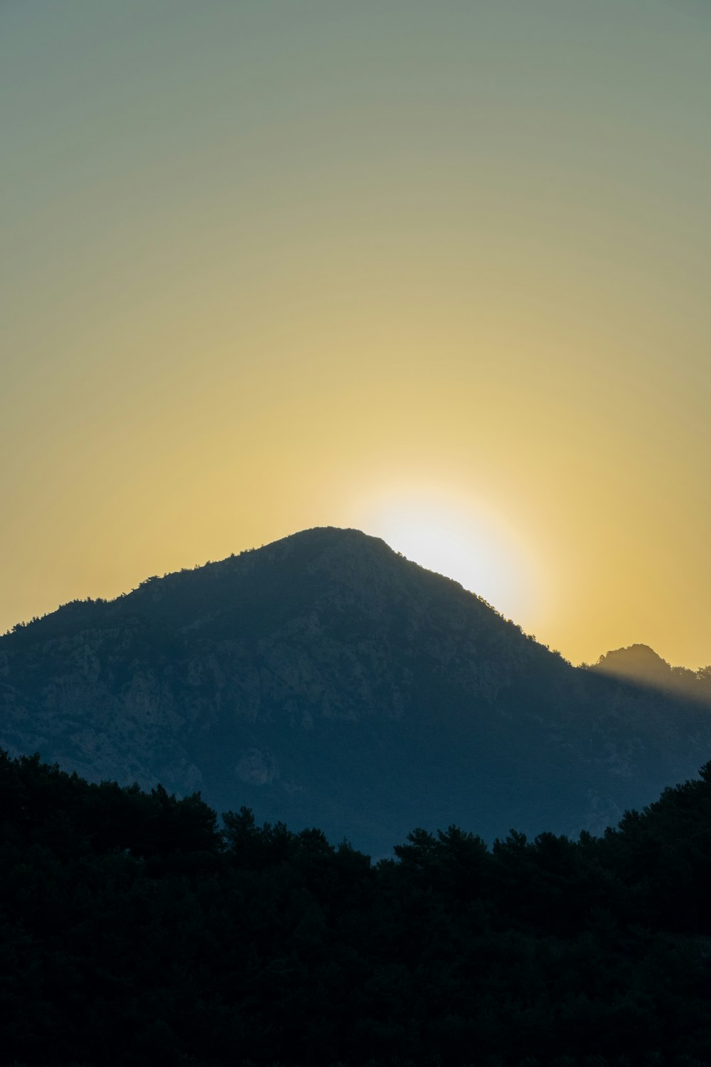 silhouette of mountain during sunset