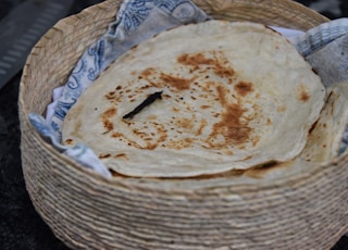 brown bread on white wicker basket