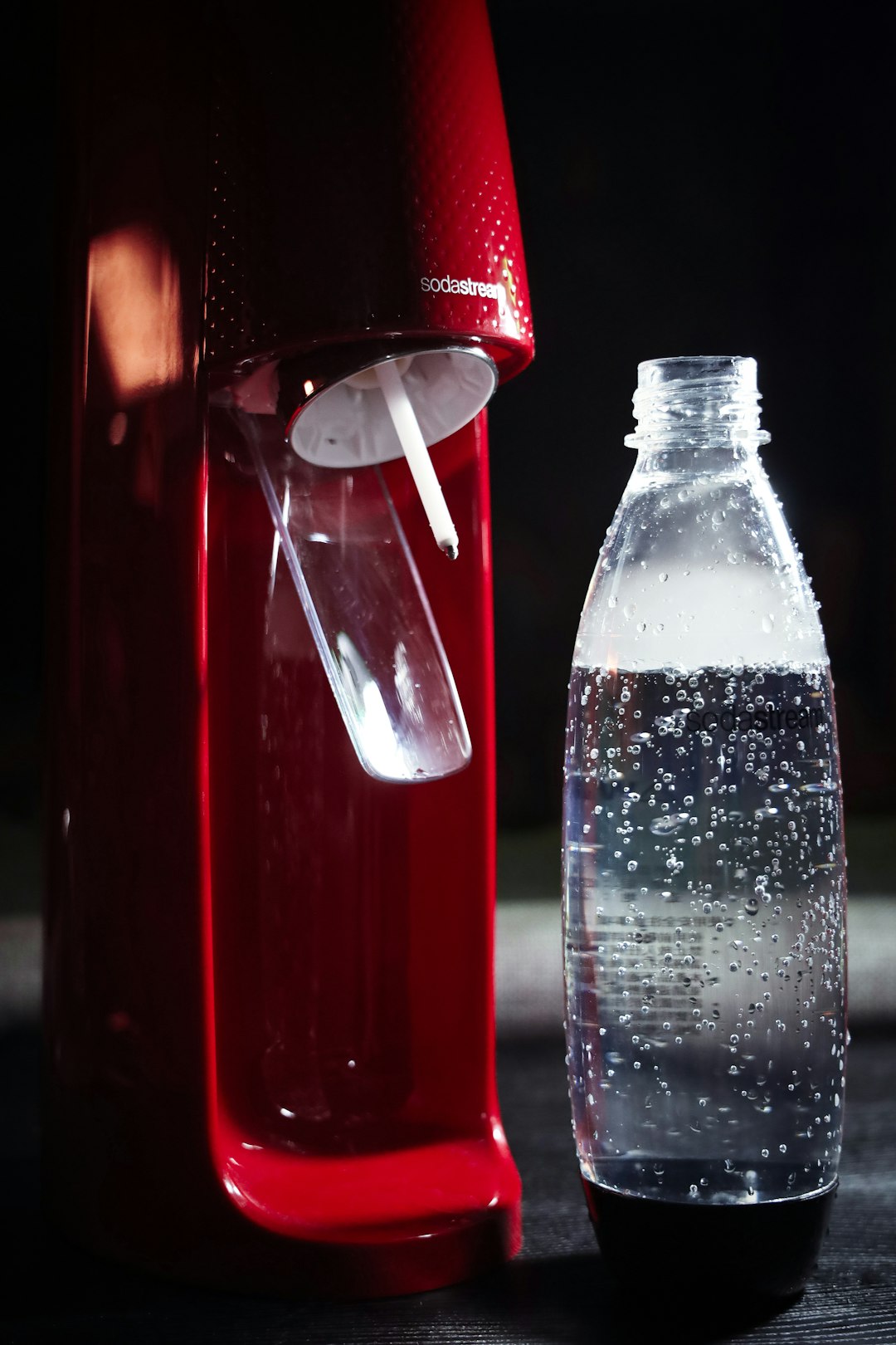clear plastic bottle with red liquid