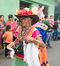 woman in white and red dress wearing brown woven hat