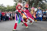 A lively street festival showcasing colorful costumes and dance