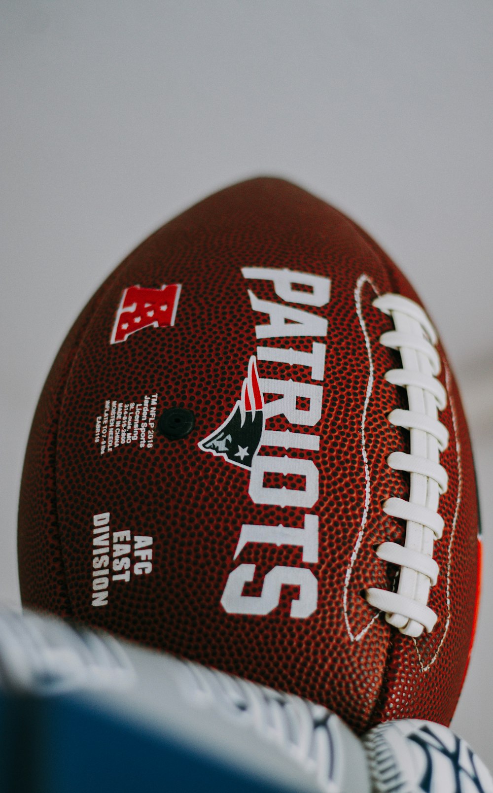 red and white football on white surface