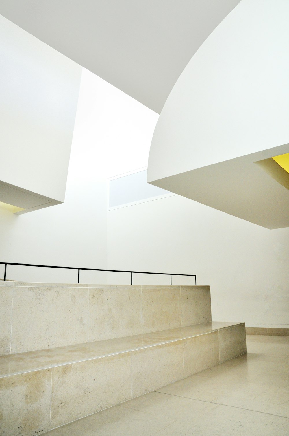 white concrete staircase with white wall paint