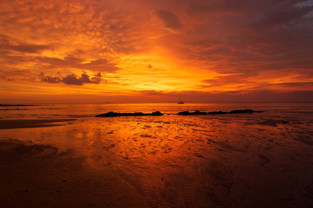 body of water during sunset