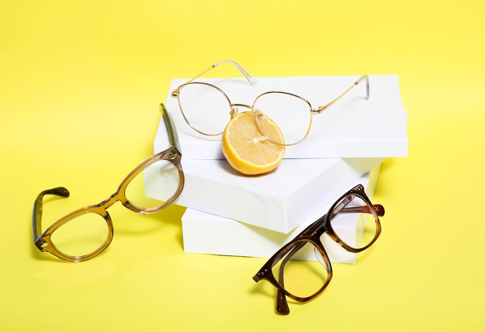 black framed eyeglasses on white paper