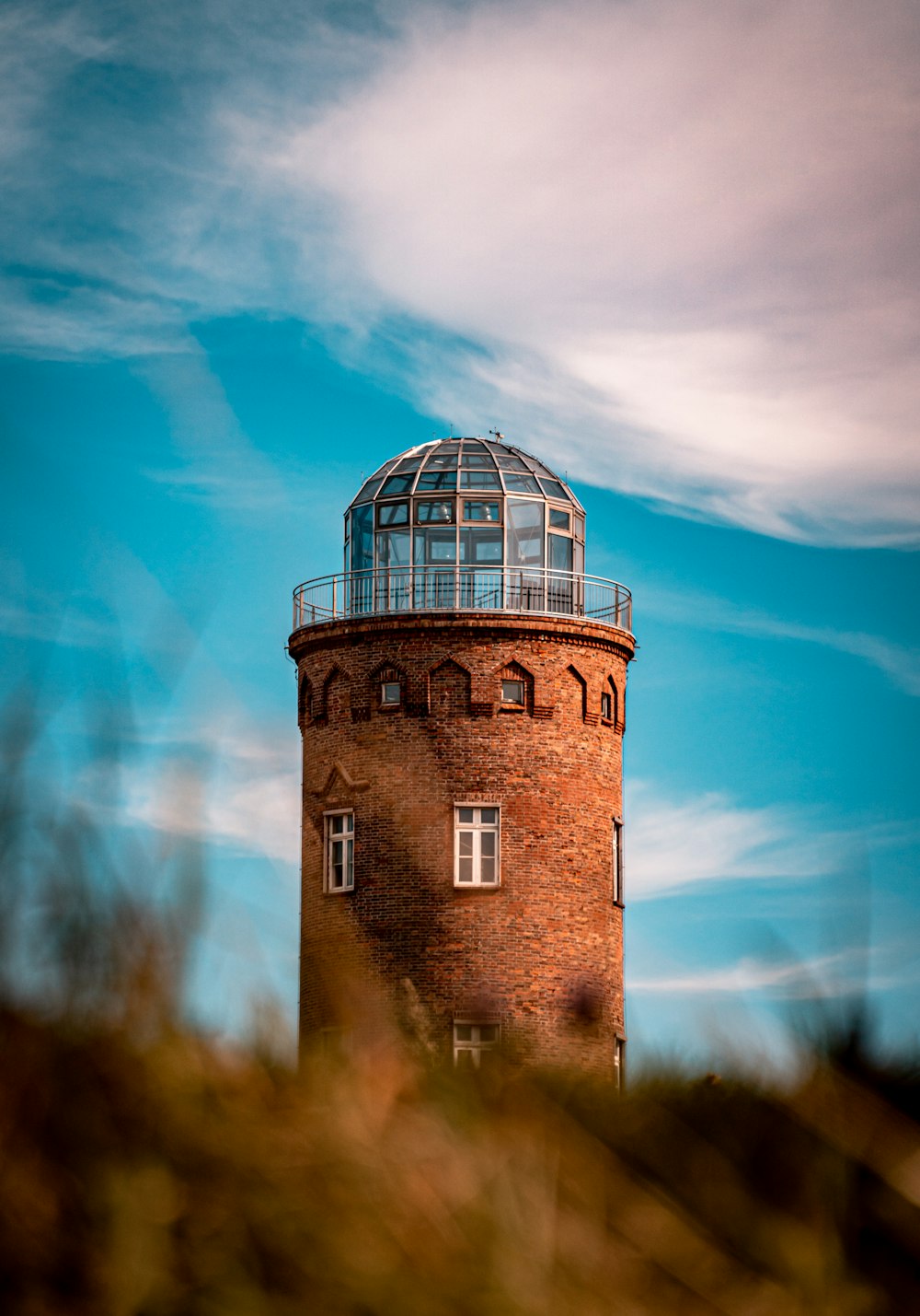 brown brick building under blue sky