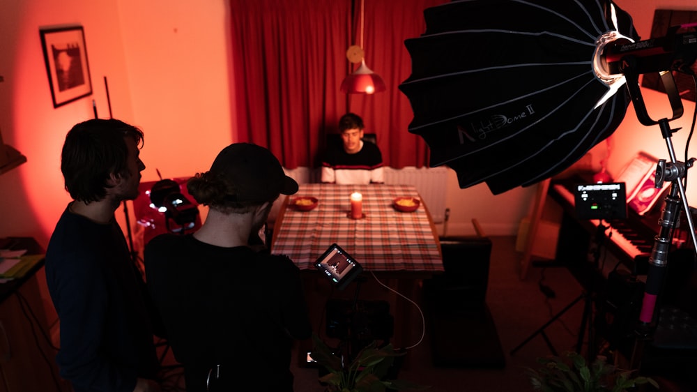 man in black shirt sitting on chair