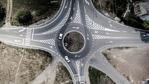 A learner confidently navigating a roundabout with instructor support.