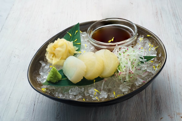 Yellow fruit on clear glass bowl