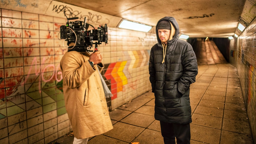 woman in black jacket holding camera