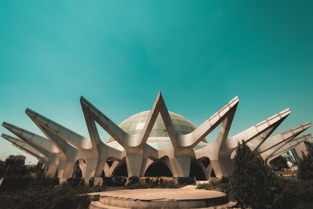 white concrete building under blue sky during daytime