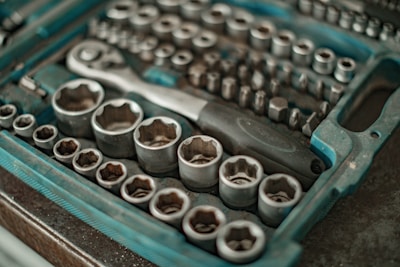 Close-up of the screwdriver set showing various S2 alloy steel bits neatly arranged in the storage case.