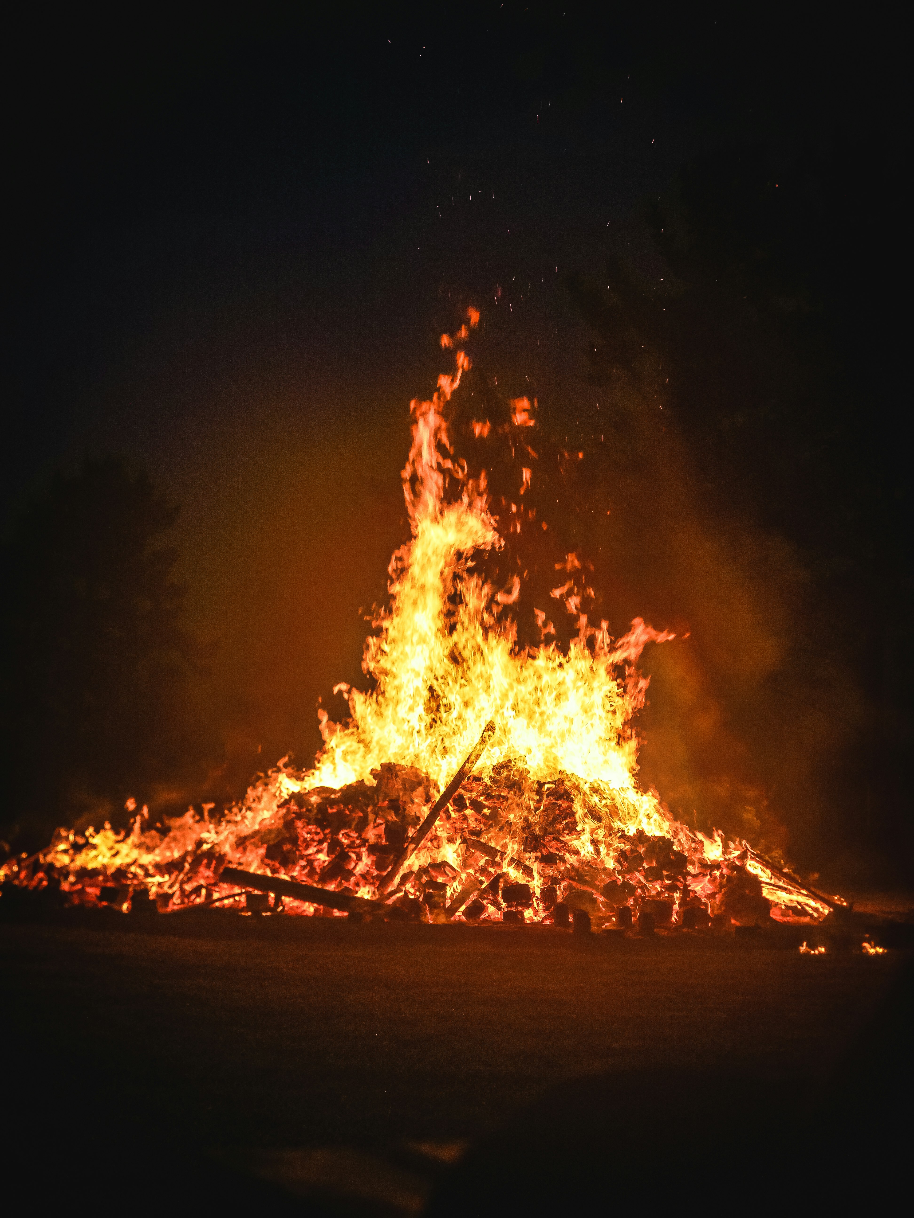 bonfire on brown sand during nighttime