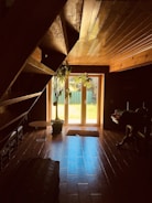 Cozy interior living room with wooden floors and warm sunlight coming through.