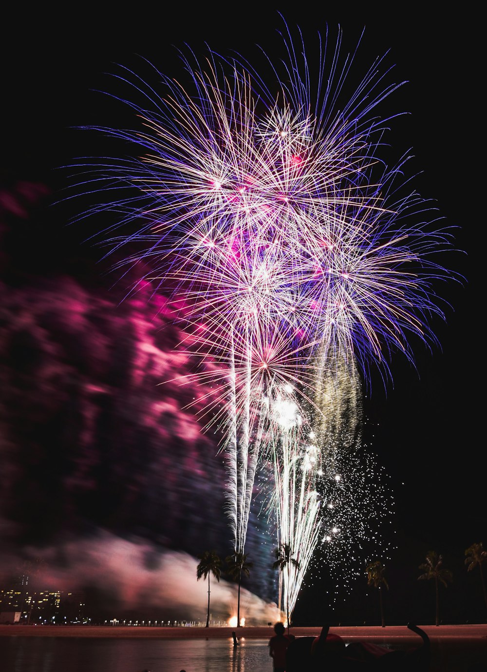 pink and white fireworks display during nighttime