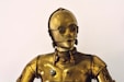 person wearing gold mask and mask