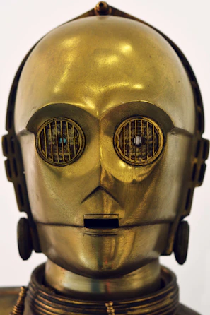 A sleek silver robot mid-shake with a cheeky grin and neon lights glowing.