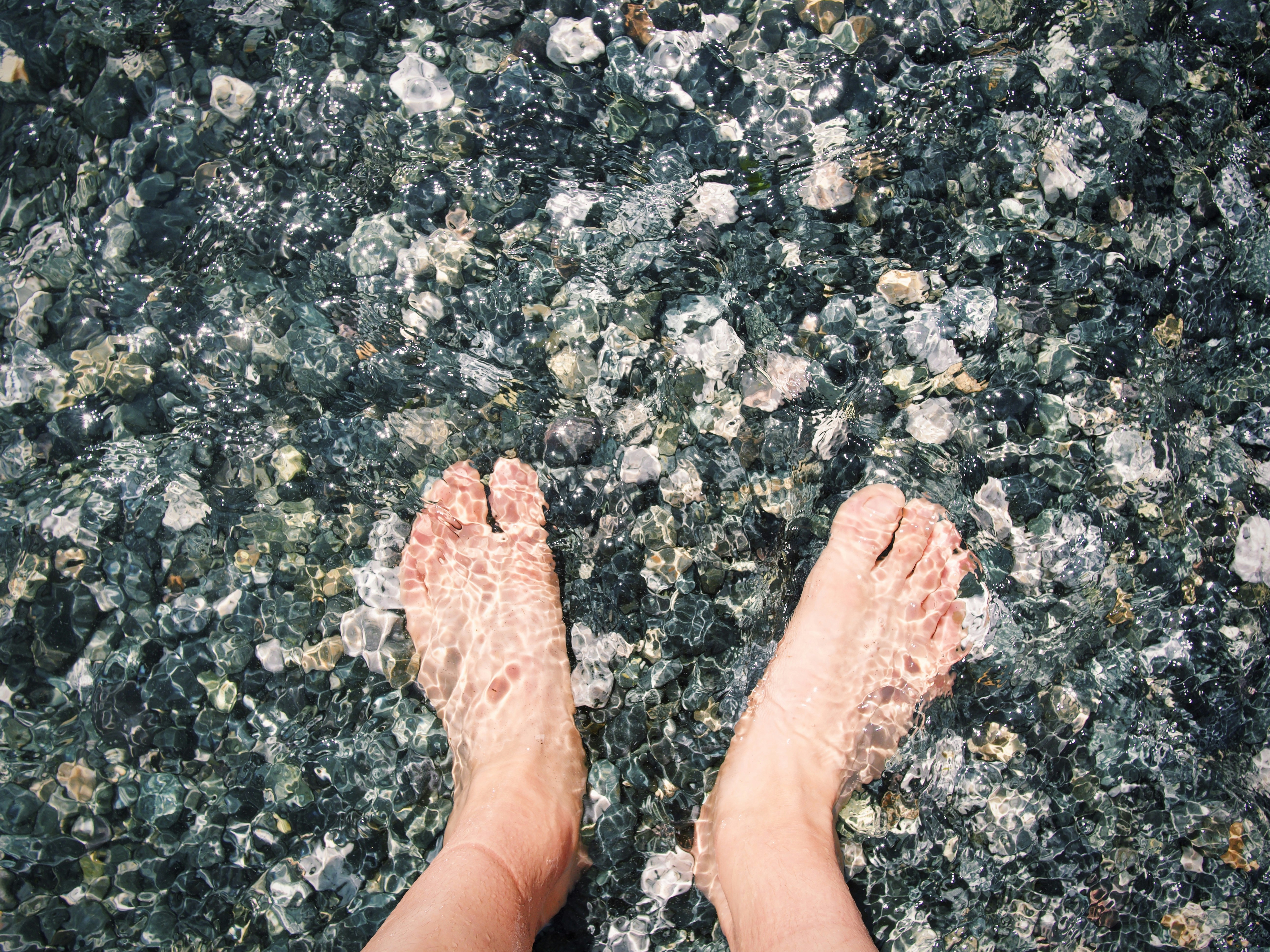 person standing on gray concrete floor