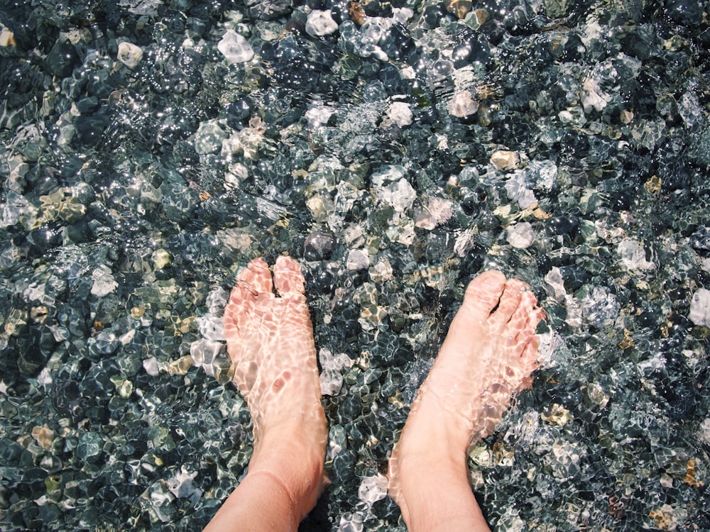 person standing on gray concrete floor