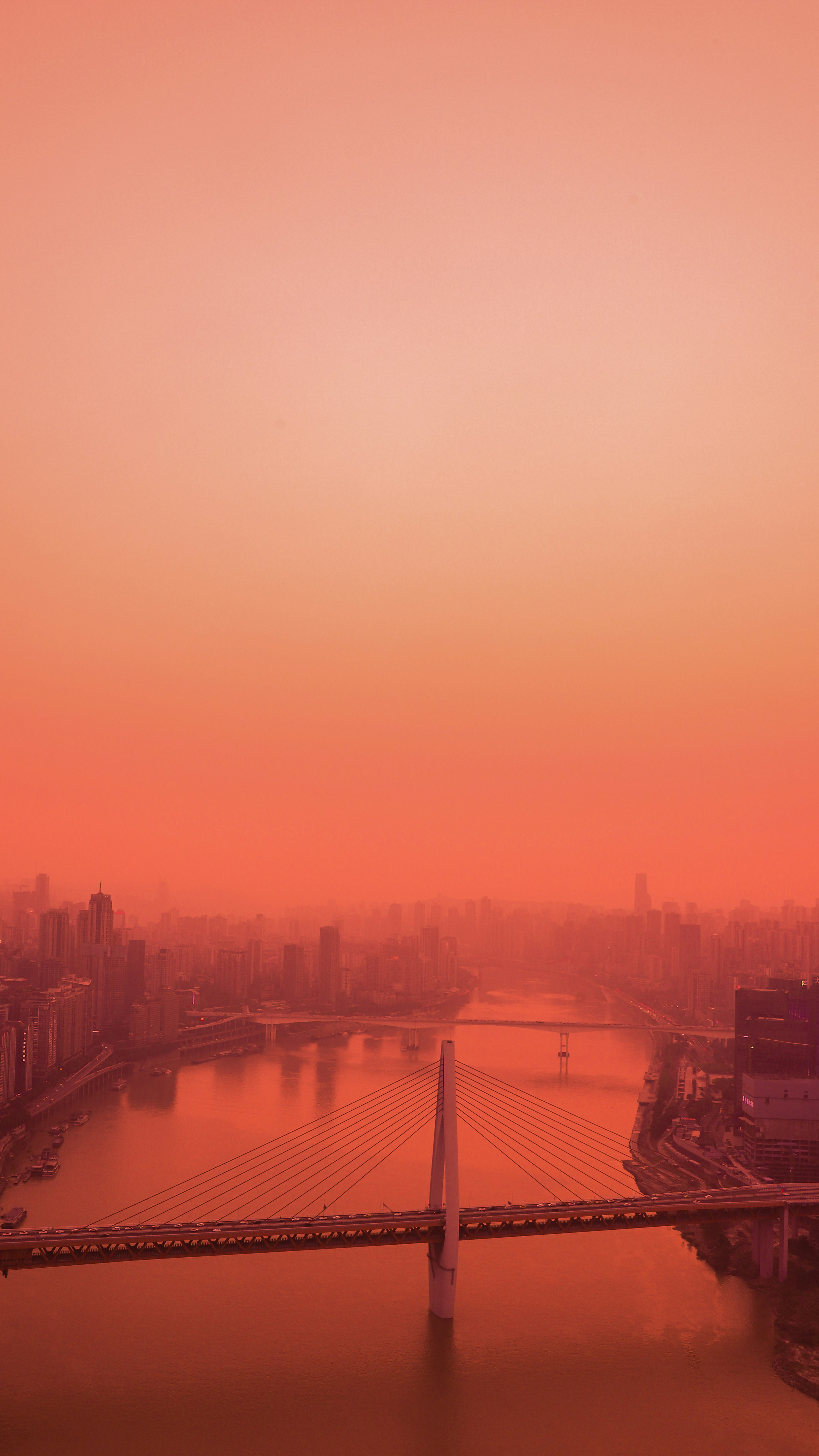 bridge over river during sunset