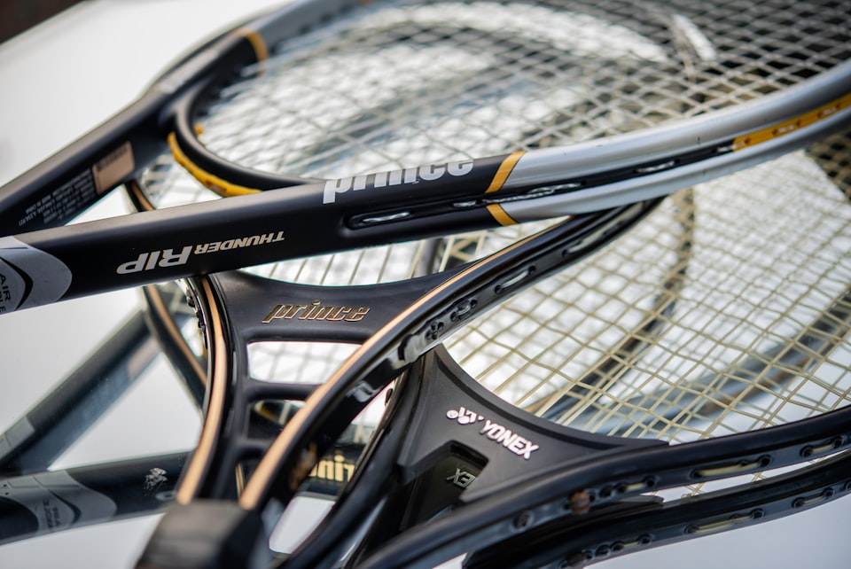 stack of tennis rackets