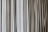 white and gray window curtain