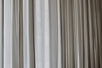 white and gray window curtain