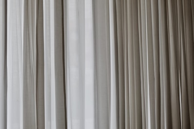 white and gray window curtain