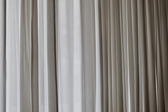 white and gray window curtain