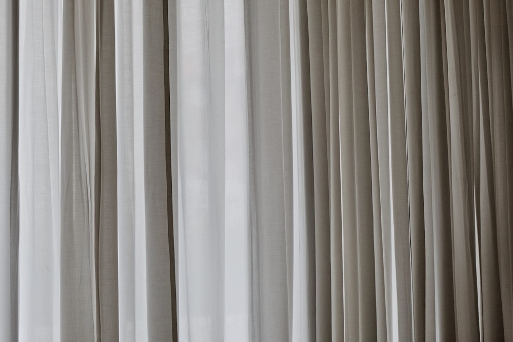 white and gray window curtain