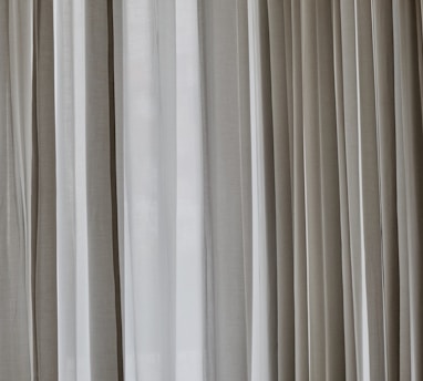 white and gray window curtain