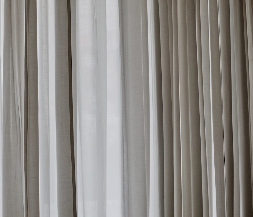 white and gray window curtain