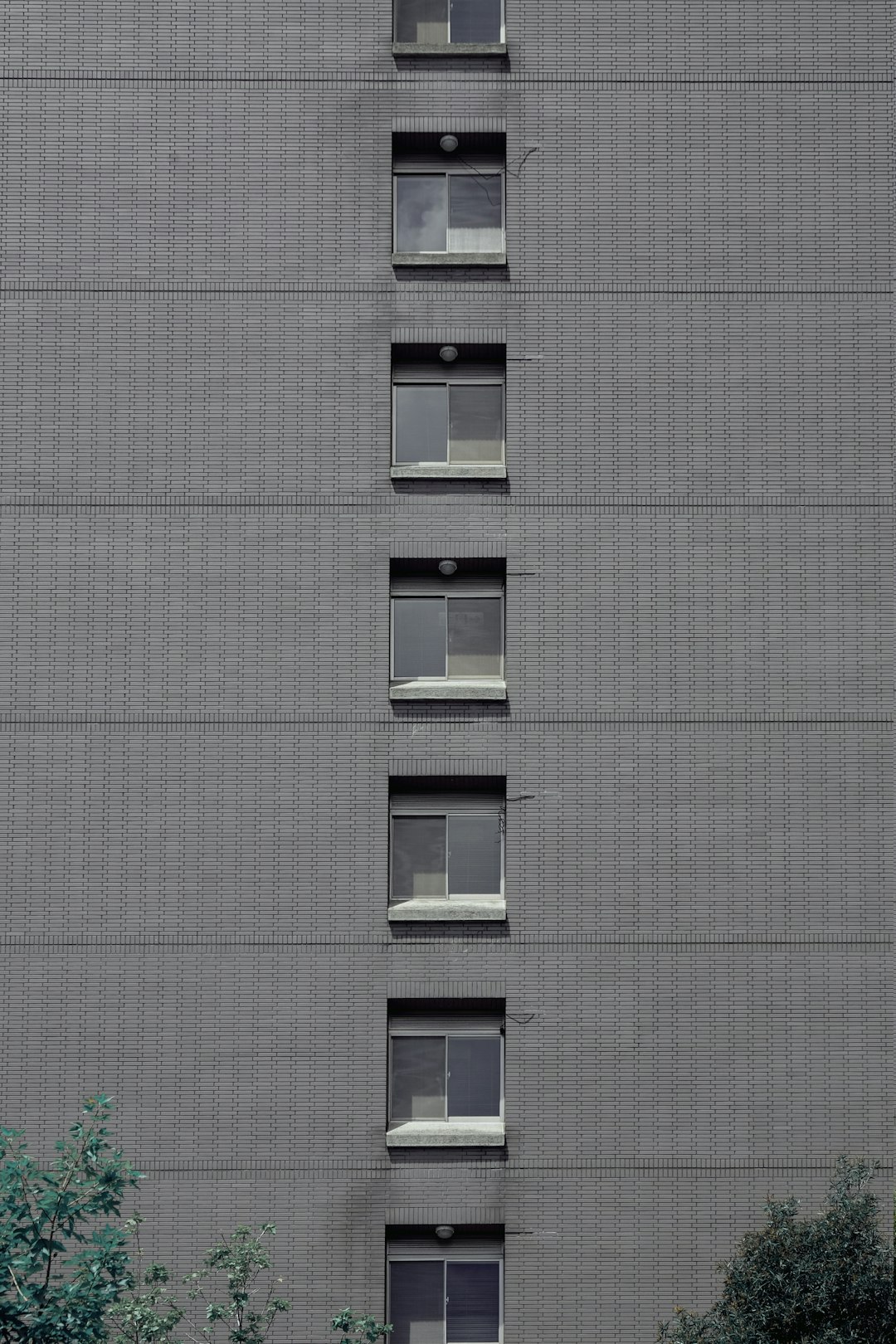 white wooden window frame on gray concrete building