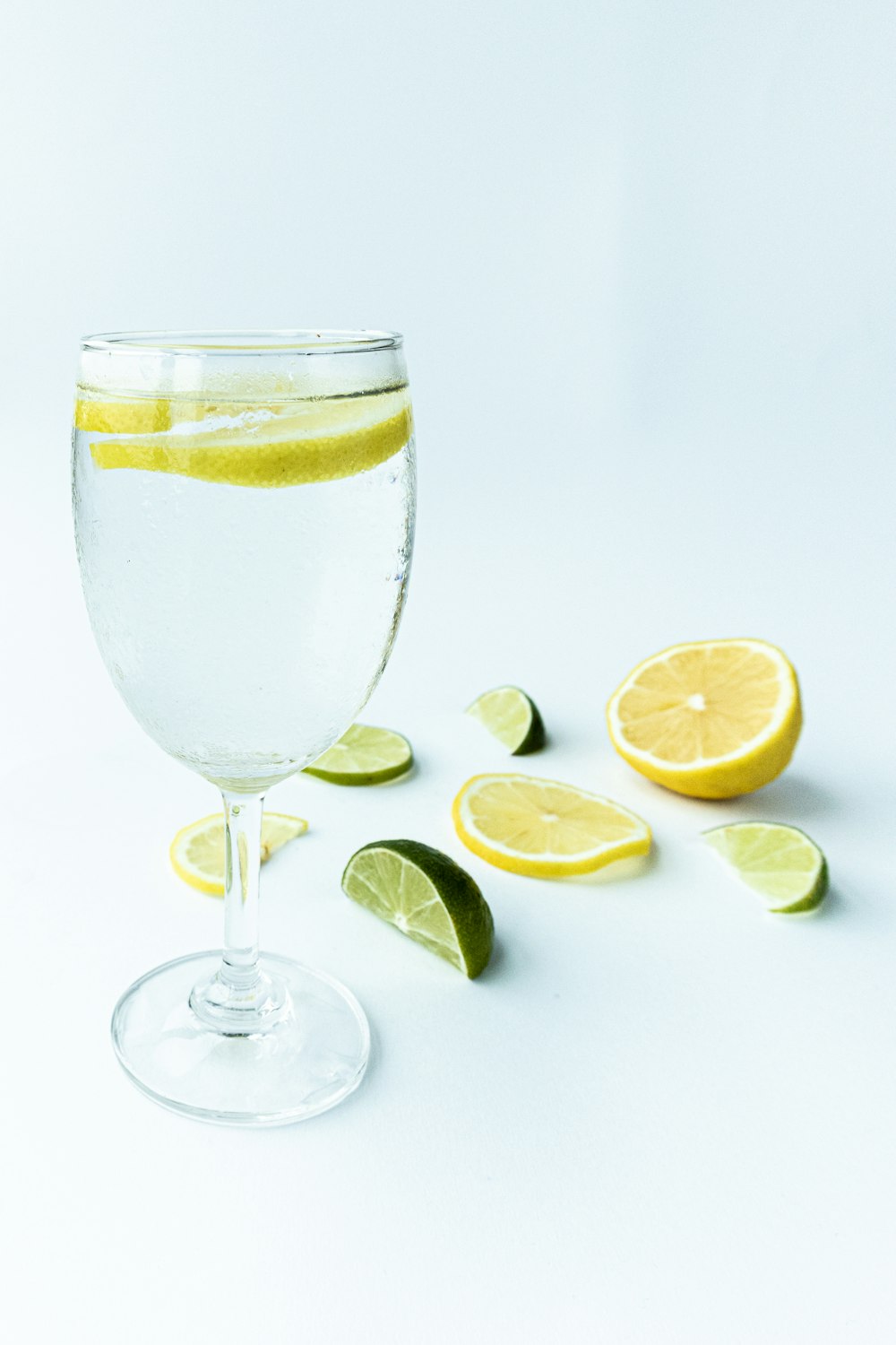 clear wine glass with sliced lemon