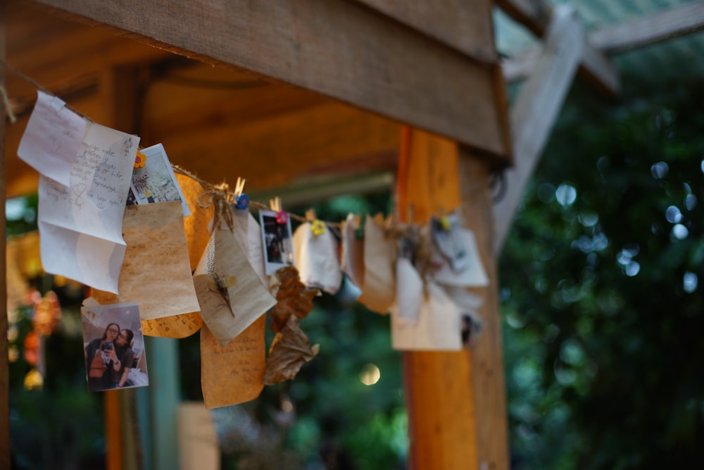 brown paper bags hanged on brown wooden pole